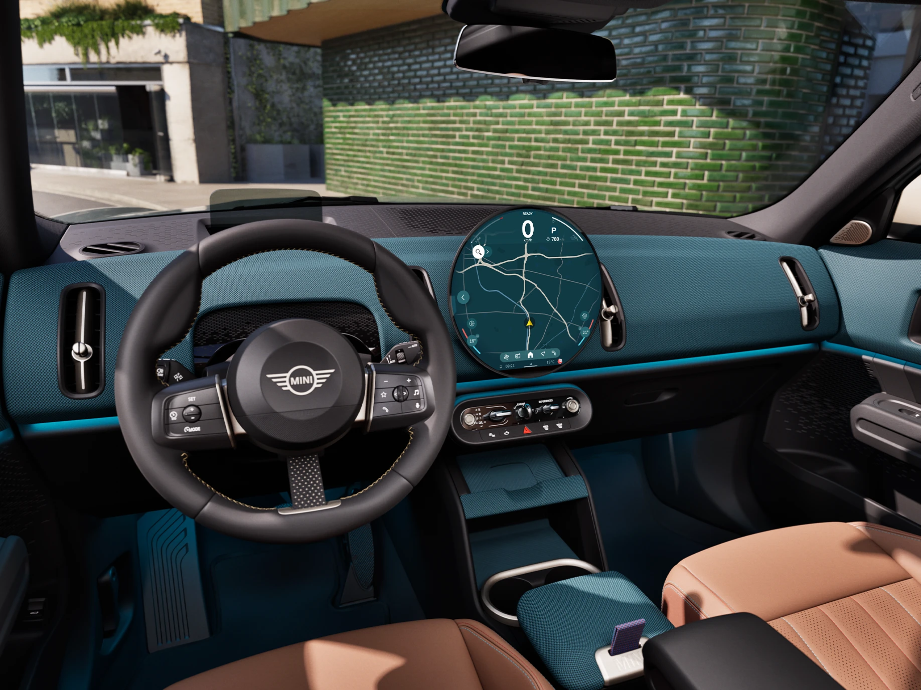 Seitliche Innenansicht des MINI Countryman mit Fokus auf Armaturenbrett und Lenkrad.