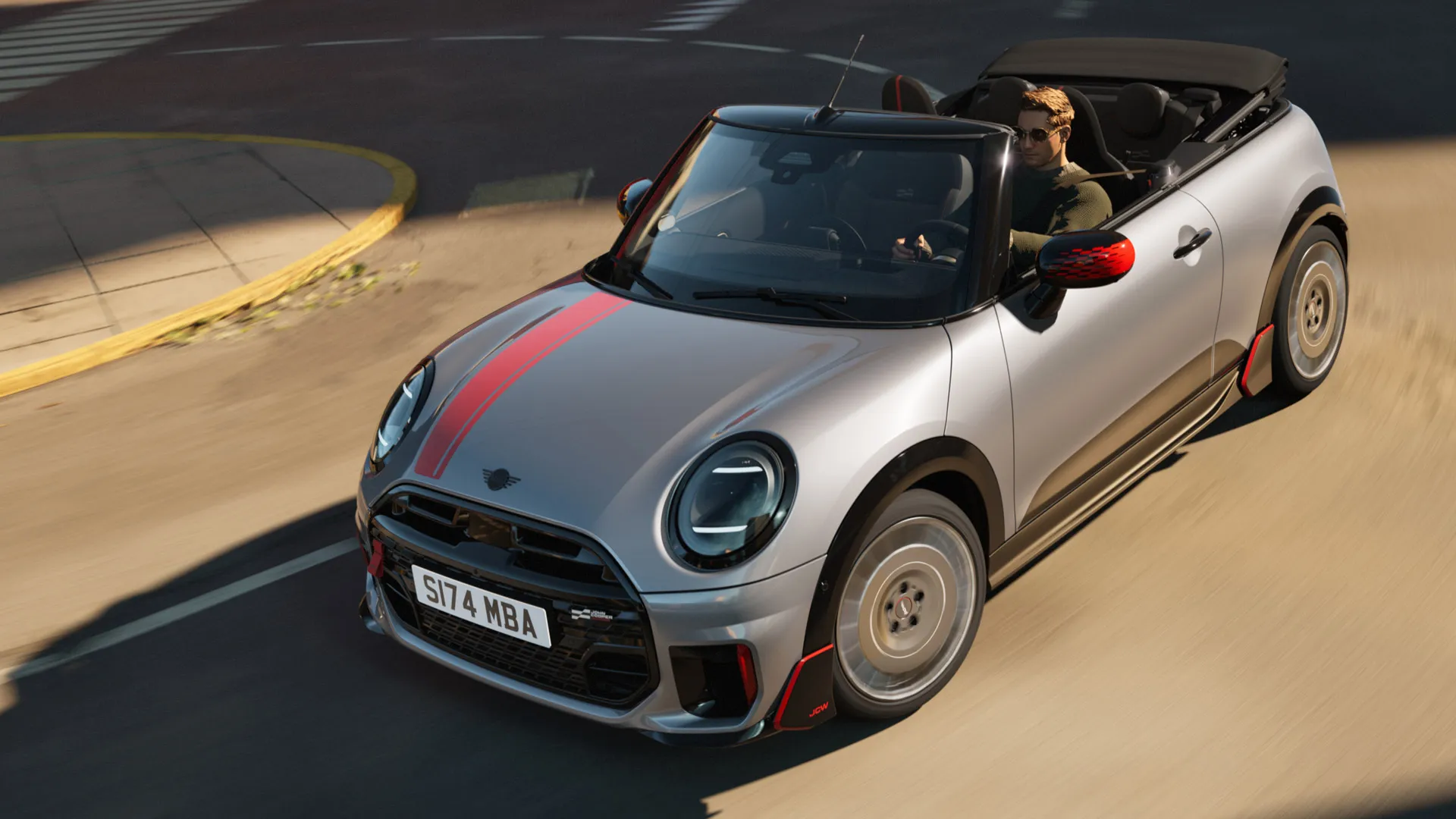 Draufsicht auf ein MINI Cabrio von vorne mit John Cooper Works Folierung in Chili Red.