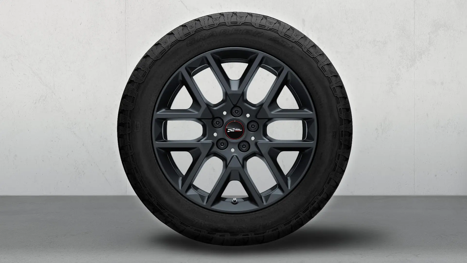 Nahaufnahme des 18-Zoll-Leichtmetallrads JCW Y-Spoke 945 in Frozen Midnight Grey.